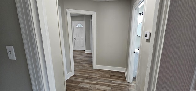 hall with dark wood-type flooring