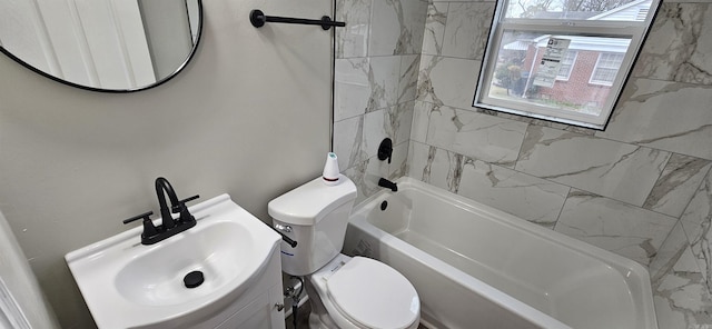 full bathroom with toilet, vanity, and tiled shower / bath combo