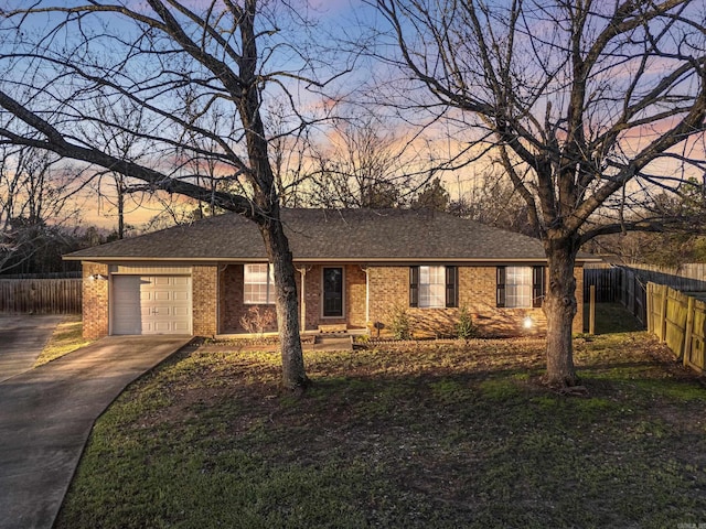 ranch-style home featuring a garage