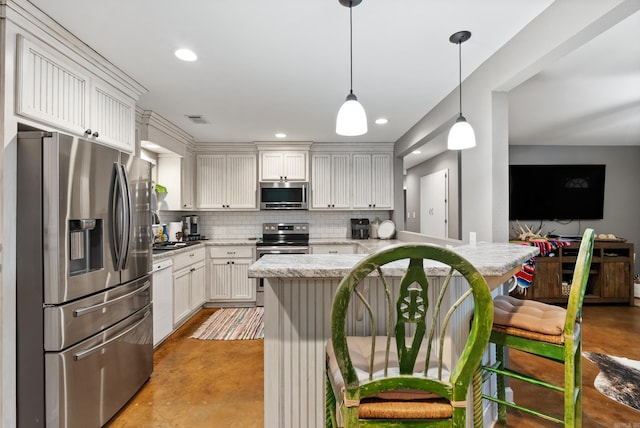 kitchen with white cabinetry, backsplash, decorative light fixtures, a kitchen bar, and appliances with stainless steel finishes