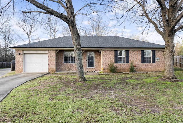 ranch-style home with a garage and a front lawn