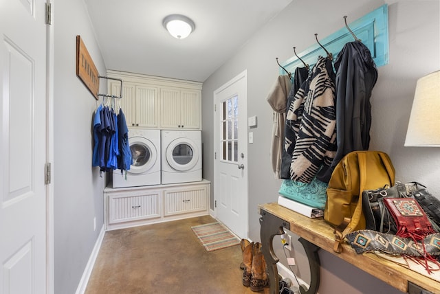 clothes washing area featuring washer and clothes dryer