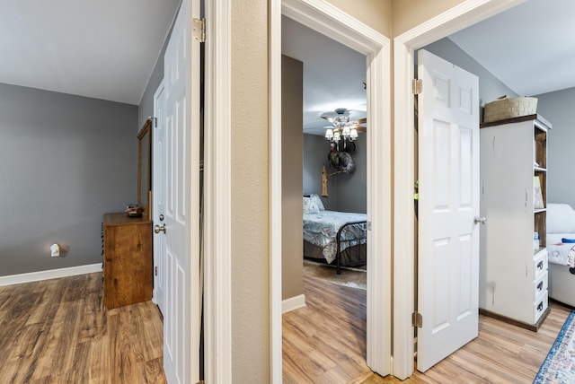 hall with light hardwood / wood-style floors