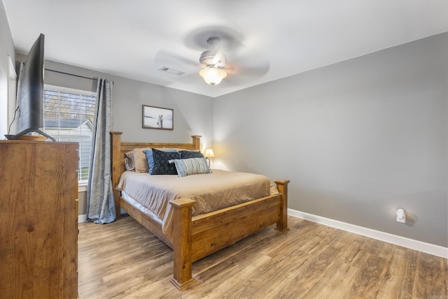 bedroom featuring ceiling fan and light hardwood / wood-style floors