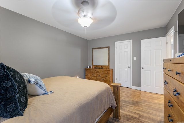 bedroom with ceiling fan and hardwood / wood-style floors