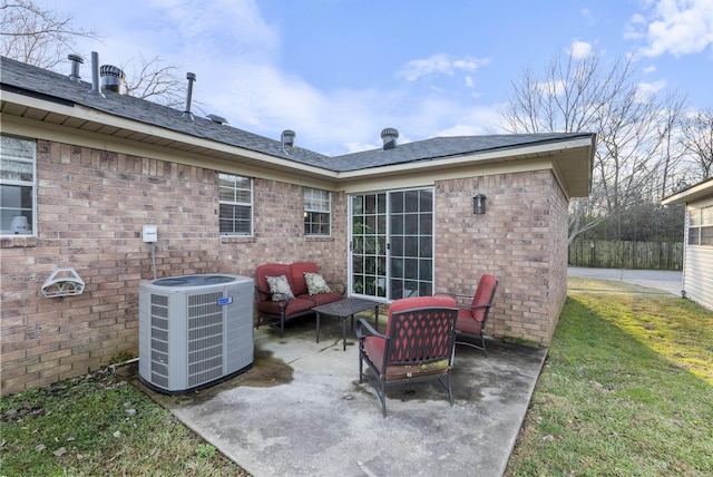 view of patio / terrace with an outdoor living space and central air condition unit