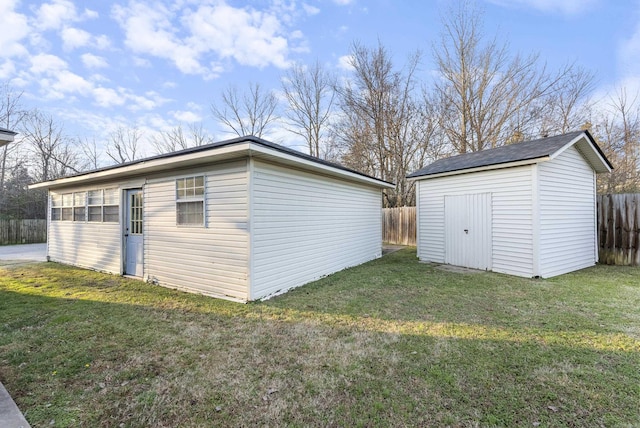 view of outbuilding with a lawn