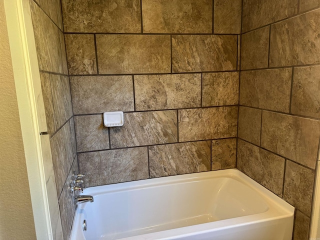bathroom featuring a washtub