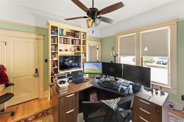 office area with ceiling fan and light hardwood / wood-style floors