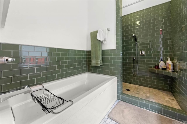 bathroom with separate shower and tub