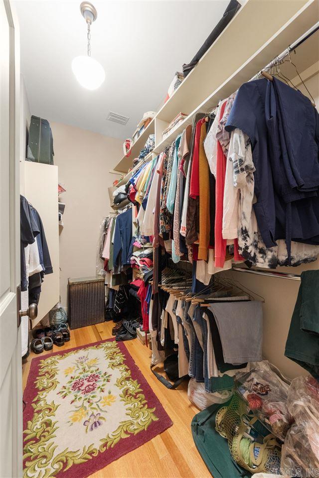 walk in closet featuring hardwood / wood-style floors