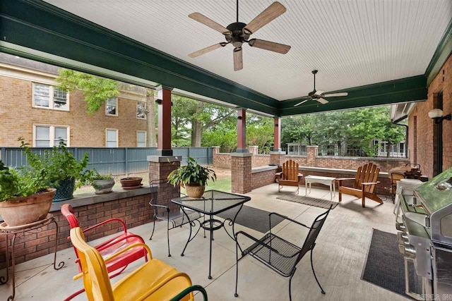 view of patio featuring ceiling fan