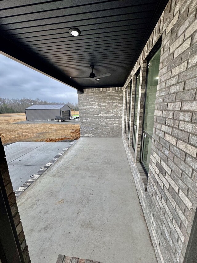 view of patio featuring a ceiling fan