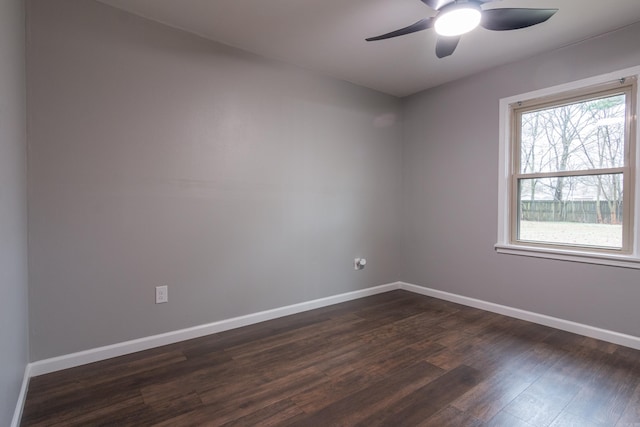 unfurnished room with ceiling fan and dark wood-type flooring