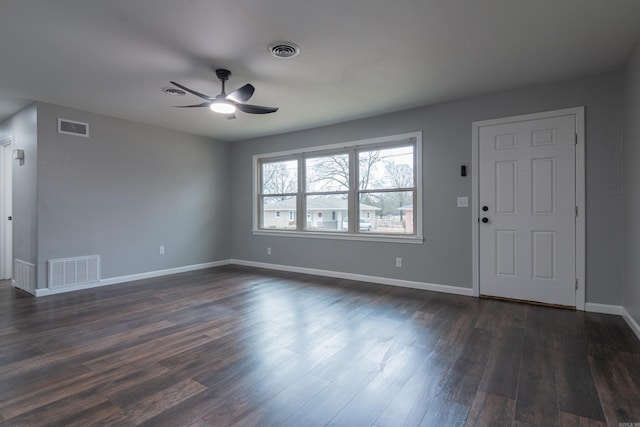 interior space with ceiling fan and dark hardwood / wood-style floors