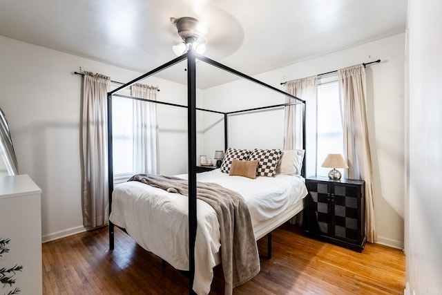 bedroom featuring hardwood / wood-style flooring and ceiling fan