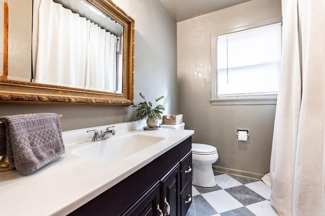 bathroom featuring vanity and toilet