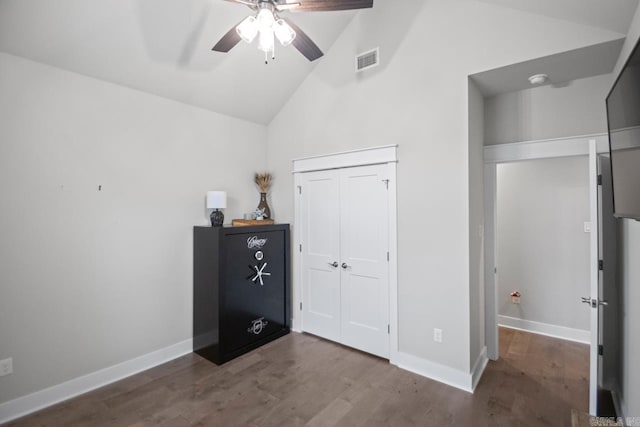 bedroom featuring ceiling fan, wood-type flooring, and high vaulted ceiling
