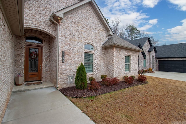 view of front of home with a garage and a front yard