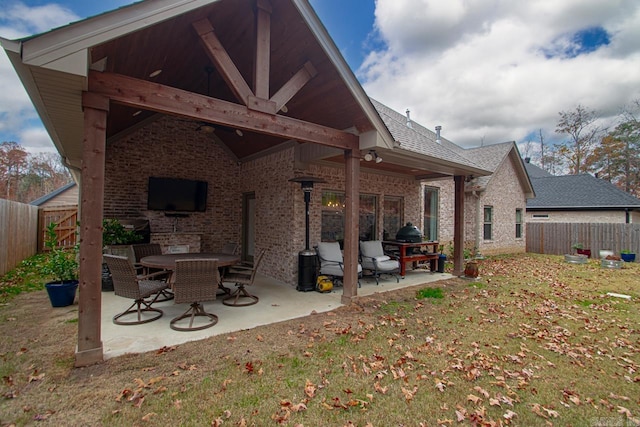 back of house featuring a yard and a patio