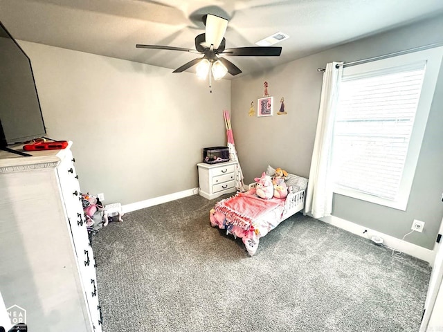 unfurnished bedroom featuring dark carpet and ceiling fan