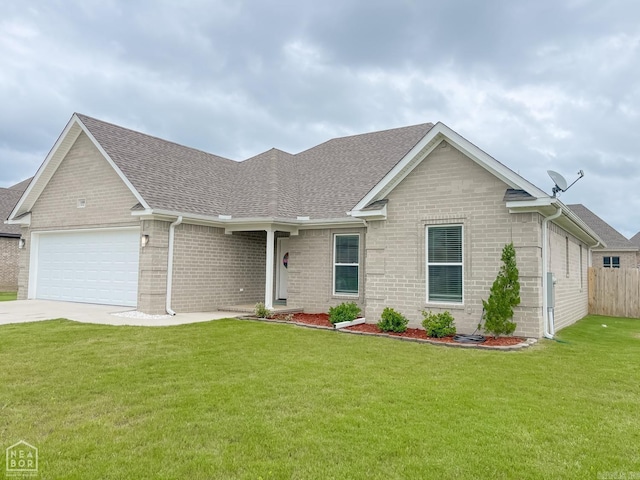 view of front of home featuring a garage and a front lawn