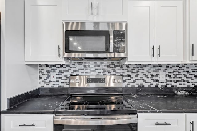108 Delle Ln, Brookland, AR 72417 - kitchen featuring tasteful backsplash, white cabinetry, and appliances with stainless steel finishes
