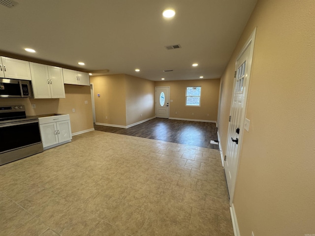 kitchen featuring white cabinets and appliances with stainless steel finishes