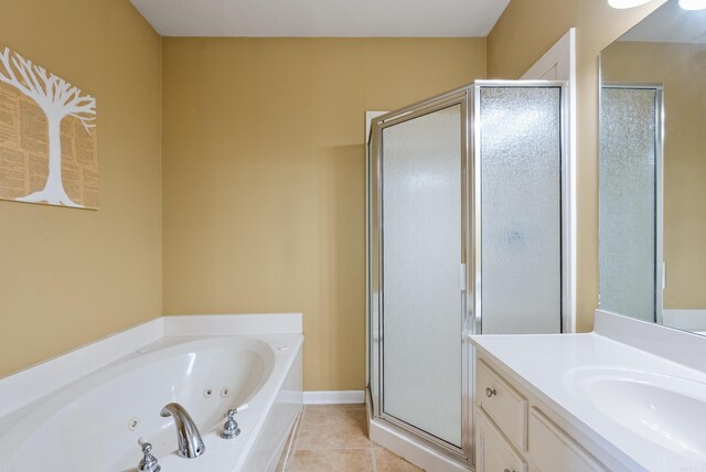 bathroom featuring vanity, tile patterned floors, and separate shower and tub