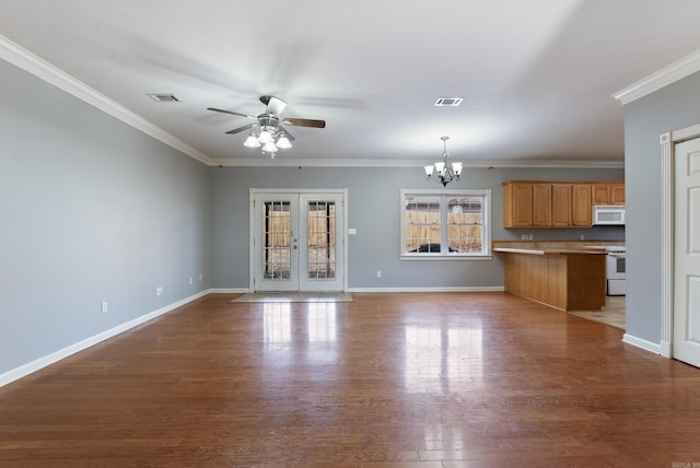 unfurnished living room featuring ceiling fan with notable chandelier, light wood-type flooring, ornamental molding, and french doors