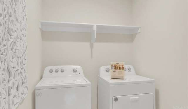 washroom featuring independent washer and dryer