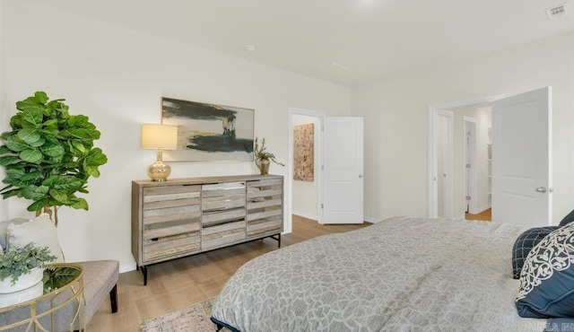 bedroom with hardwood / wood-style flooring