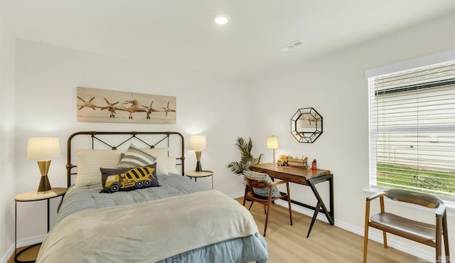 bedroom with light wood-type flooring