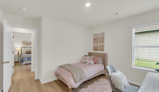 bedroom featuring light hardwood / wood-style floors