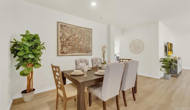 dining space featuring light hardwood / wood-style floors