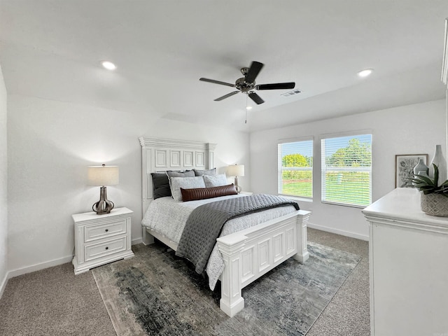 bedroom featuring dark colored carpet and ceiling fan