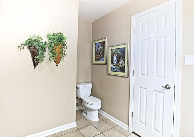 bathroom with tile patterned flooring and toilet