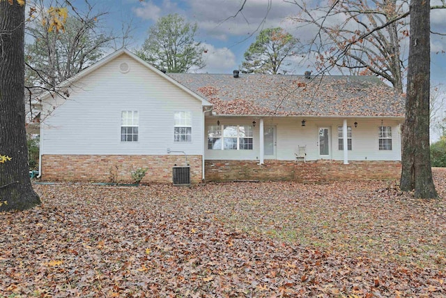 back of house featuring cooling unit