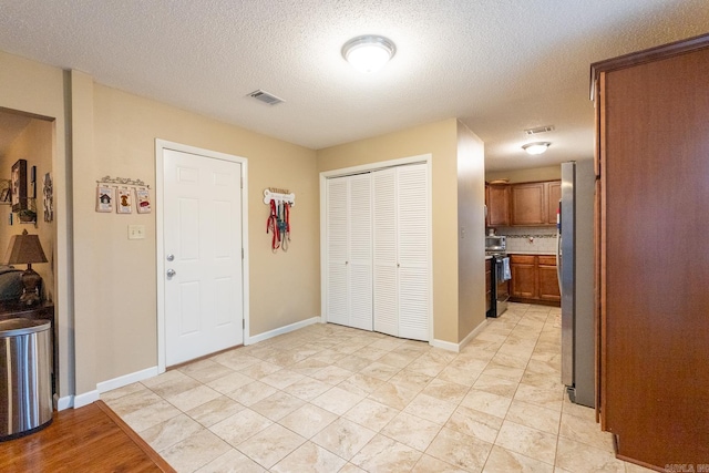 foyer featuring a textured ceiling