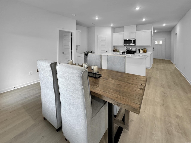 dining space featuring light hardwood / wood-style flooring