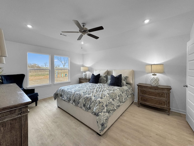 bedroom with ceiling fan and light hardwood / wood-style floors