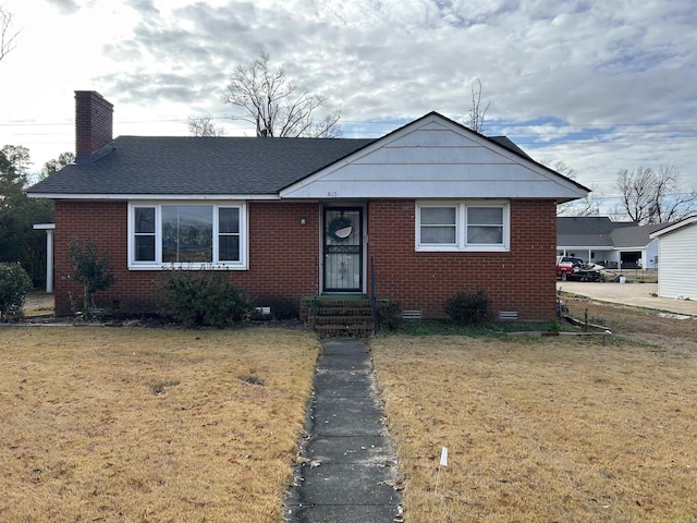 bungalow-style home featuring a front lawn