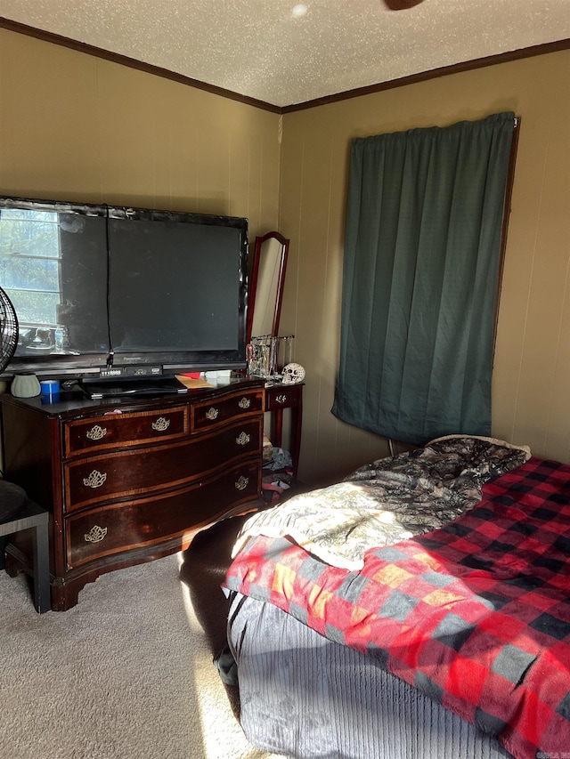 bedroom featuring a textured ceiling and carpet flooring