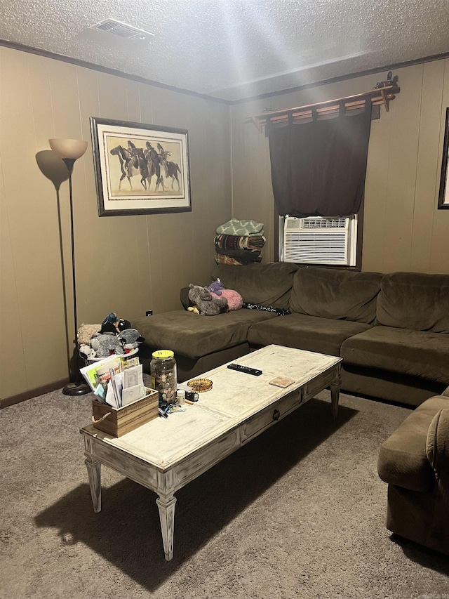 carpeted living room with cooling unit and a textured ceiling