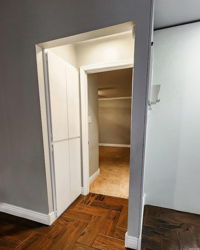 hall with dark parquet floors