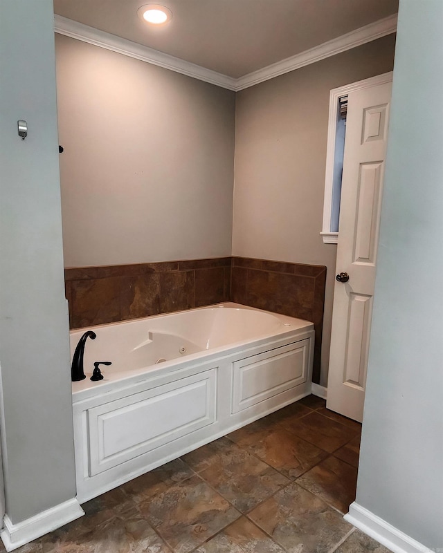 bathroom with crown molding and a bath