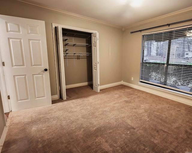 unfurnished bedroom featuring carpet flooring, a closet, and ornamental molding