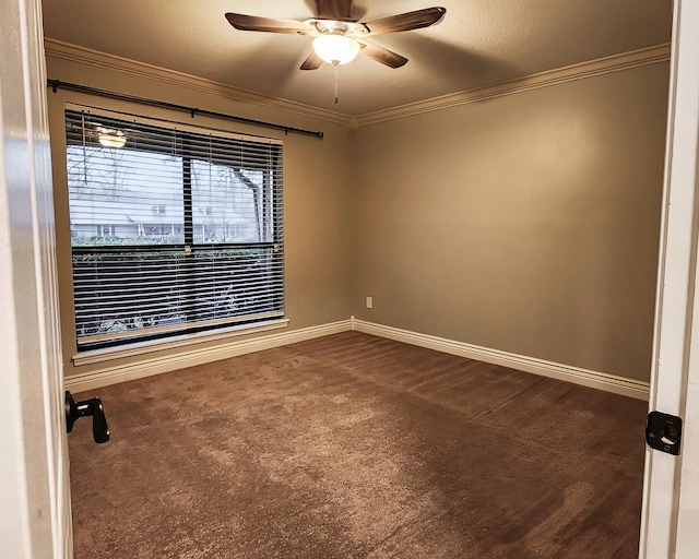 carpeted empty room with crown molding and ceiling fan