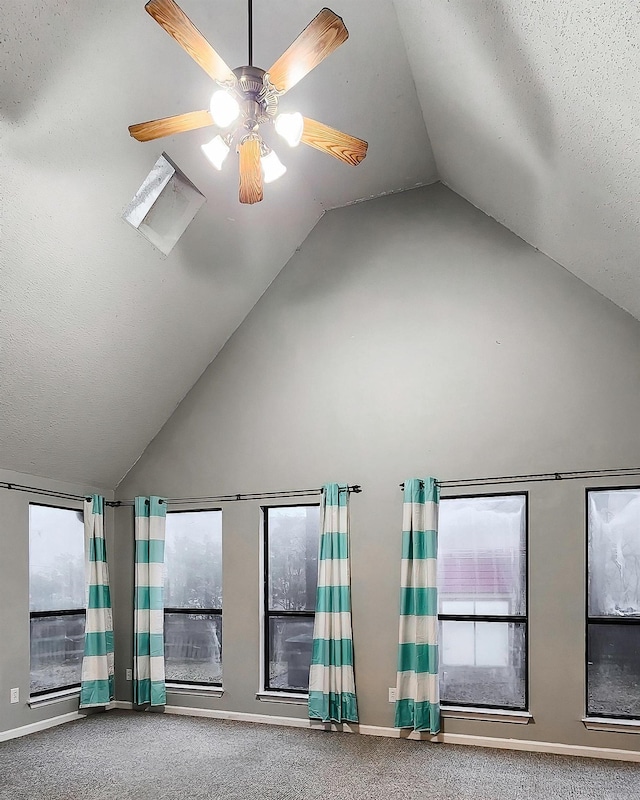 interior space with ceiling fan and lofted ceiling