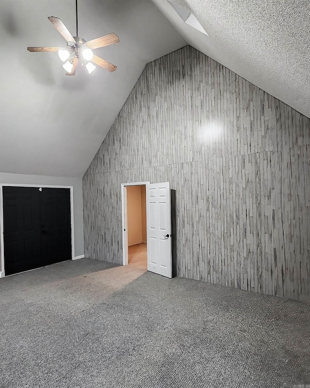 bonus room featuring carpet floors, vaulted ceiling, and ceiling fan